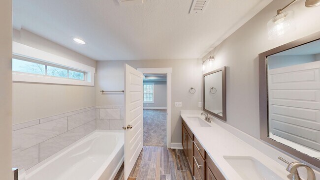 Building Photo - Beautifully Upgraded Home | Stone Fireplace, Open Kitchen and Two-Car Garage