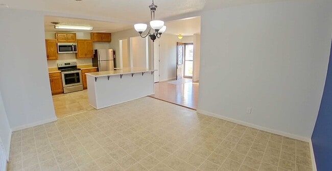 Building Photo - Covered Patio + HUGE Yard + Stainless Steel Appliances + Bonus Storage! Available March 6th!