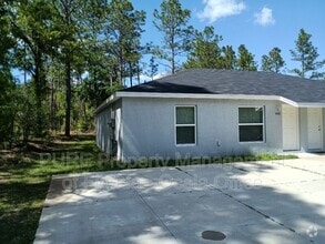Building Photo - 9426-9428 N Manashee Dr