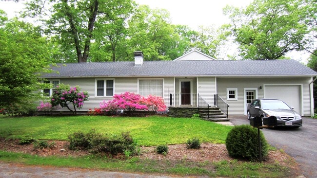 Front of house with gardens, Goshen stone patio, main entrance, azeleas, rhododendrons, garage. - 30 Fairfield Ave