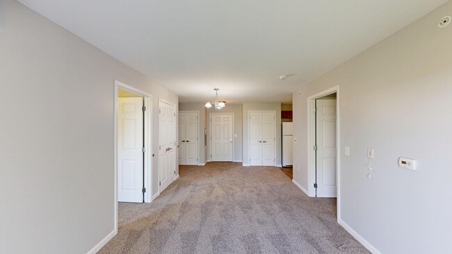 Living Room With Dining Area - Meyer Pointe Senior Apartments