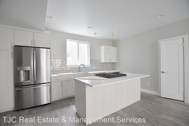 Building Photo - 2 br, 2.5 bath House - 4923 Lowell Blvd Un...