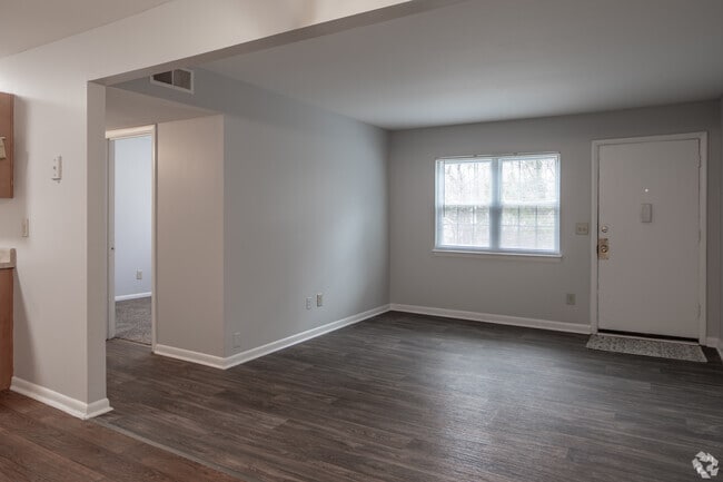 3BR, 1BA - 875SF - Living Room - Pine Forest Apartments