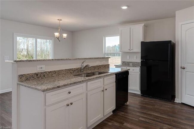 Photo - Spacious 3-Bedroom + Loft Home in Meredith Woods – Stylish, Efficient, and Perfect for Entertaining!