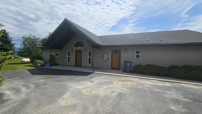 Building Photo - Out of town house with double garage and l...