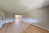 Located at 44 Center Grove Road in Randolph, NJ, this single-floor, one-bedroom, one-bathroom unit offers a clean and functional layout with consistent light hardwood flooring throughout. The open living and dining areas are bright and airy, benefiting from natural light through double-hung windows, and feature neutral-toned walls that create a calm, cohesive ambiance. A wall-unit HVAC system and baseboard heating ensure year-round comfort. The kitchen is a standout feature, showcasing warm honey-toned wood cabinetry with raised-panel detailing, white quartz countertops, a subway tile backsplash, and a stainless steel sink — providing ample storage and prep space. The spacious bedroom includes access to a dedicated closet as well as proximity to the full bathroom, which is equipped with a tiled tub-shower combination, a window for natural light, and clean white finishes. Three closets are distributed throughout the unit, offering excellent storage capacity. A hallway connects the living areas to the private spaces, contributing to a logical and efficient floor plan. The unit's neutral palette, updated finishes, and well-maintained condition make it a comfortable and move-in ready space in Randolph, NJ.