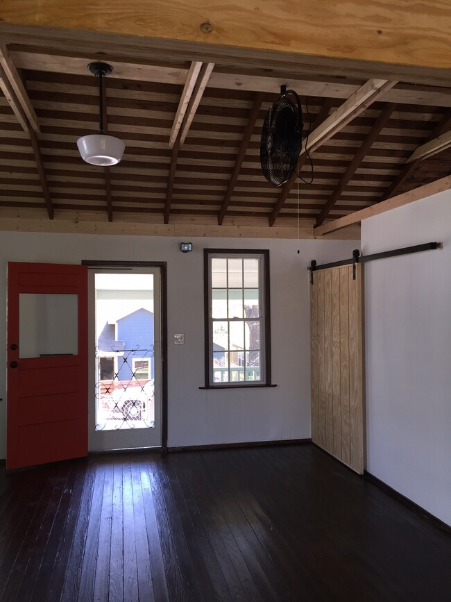 Great living room with 'barn doors' to bedroom - 2204 E 8th St