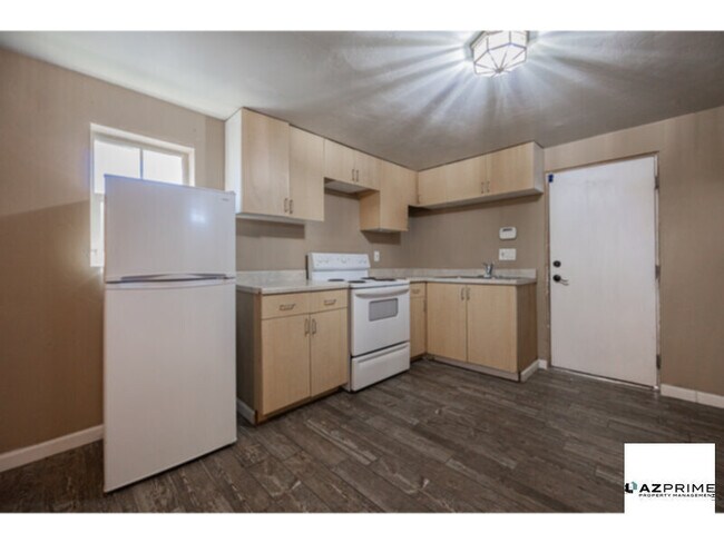 Building Photo - Welcome to this Charming and Spacious Stud...