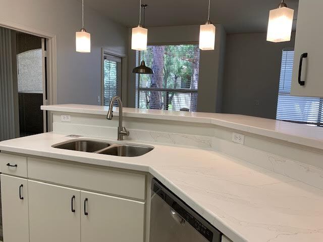 Kitchen has brand new quartz countertops, sink, faucet. - 9550 E Thunderbird Rd