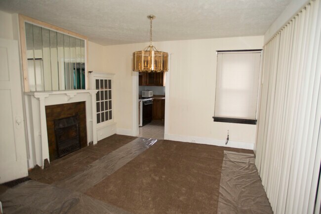 Dinning room-faux fireplace - 703 Midland St