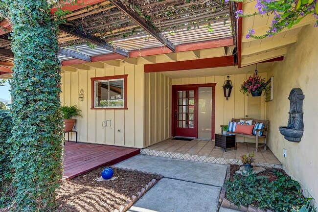 Welcoming front seating area and fountain for a relaxing entry into the home. - 8055 Morocco Dr