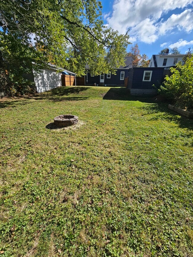 Large fenced in yard with firepit - 1740 Fairmount Pky