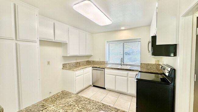 Building Photo - Sweet Walk-up, Ground Level Condo Unit in ...