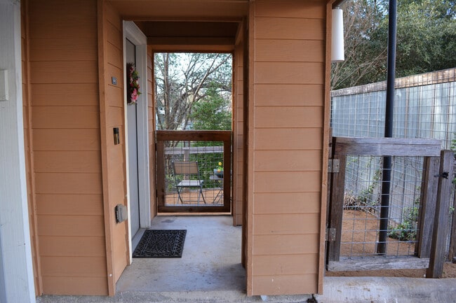 covered front entrance with small fenced in yard - 2606 Wilson St