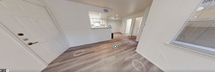 This 610 square foot apartment in The Woodlands, Texas, offers a thoughtfully designed living space on a single floor. The layout comprises one bedroom, one bathroom, a kitchen, and a living room, making efficient use of the available area.

The kitchen features modern appliances, including a stainless steel refrigerator and oven. White cabinetry with wooden accents provides ample storage, while a breakfast bar separates the kitchen from the living area, enhancing the open-concept feel.

The living room is bright and airy, with large windows allowing natural light to flood the space. A ceiling fan adds to the comfort and air circulation. The bedroom, measuring 150 square feet, offers a cozy retreat with windows providing views and natural illumination.

The bathroom is well-appointed with a combination tub-shower, a single vanity with storage, and a modern toilet. The apartment also includes a closet with built-in shelving and hanging rods for organized storage.

Throughout the apartment, light-toned walls contrast beautifully with the modern, wood-look flooring, creating a warm and inviting atmosphere. The neutral color palette allows for easy personalization to suit individual tastes.

This compact yet functional apartment is ideal for individuals or couples looking for a low-maintenance living space in The Woodlands area. Its efficient design maximizes every square foot, providing comfortable living in a well-planned environment.