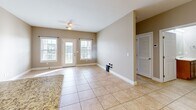 Located at 3455 Trail Head Dr in Paducah, KY, this single-floor, 2-bedroom, 2-bathroom home offers a functional and comfortable layout. The kitchen is a standout feature, showcasing warm wood cabinetry, granite countertops, a stone tile backsplash with a decorative diamond accent, and a full suite of stainless steel appliances including a refrigerator, range, microwave, and dishwasher. Large tile flooring runs throughout the kitchen and living areas, while a pendant chandelier and recessed lighting add warmth.

The living area is bright and open, benefiting from natural light streaming through multiple windows and glass French doors that lead to an outdoor space, complemented by a ceiling fan overhead. Both bedrooms feature plush carpeting, ceiling fans, and neutral-toned walls. The spacious primary bedroom connects to a dedicated bathroom and includes access to a walk-in closet outfitted with wire shelving systems for organized storage.

Both bathrooms are finished with tile flooring, wood-toned vanities with white countertops, and tub/shower combinations. Clean lines and neutral tones throughout the home create a cohesive, move-in-ready aesthetic well-suited for comfortable everyday living.