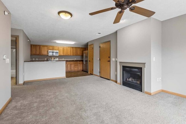 Enjoy the comfort of open-concept living in this inviting space, where cozy details and seamless flow make entertaining effortless. - Grand Legacy
