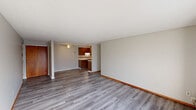 Located at 2709 38th St NW in Canton, Ohio, this two-bedroom, one-bathroom unit offers a well-organized single-floor layout designed for comfortable everyday living. The open-concept living and dining area is finished with light gray laminate flooring, neutral-toned walls, and a ceiling fan, creating a bright and airy atmosphere. Sliding glass doors lead from the living area to a private balcony, allowing for natural light and outdoor access. The kitchen is positioned adjacent to the dining area and features warm wood cabinetry, a tile backsplash, white countertops, and stainless steel appliances, including a dishwasher and refrigerator. Both bedrooms are carpeted for comfort and each includes a ceiling fan and generous closet space with sliding wood-panel doors. The primary bedroom benefits from a window that brings in natural light. The full bathroom is appointed with a wood-toned vanity, a large mirror, and a shower-tub combination. Additional spaces include a hallway, entrance foyer, utility room, and three closets throughout, ensuring ample storage. The unit offers a clean, functional layout suited to a range of lifestyles.