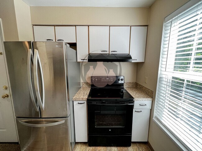 Building Photo - Adorable Ground Level Charbonneau Condo - ...