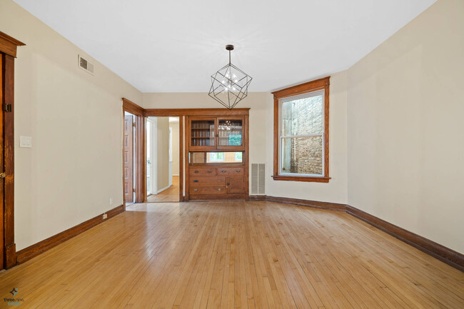 Spacious, formal dining room with chandelier - 2323 N Albany Ave
