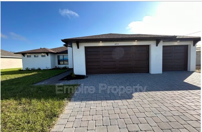 Building Photo - Beautiful 4 Bedroom, 2 Bath Home with 3-Car Garage in Cape Coral