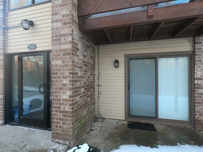 Doorwall with view of the woods - 7815 Manor Cir
