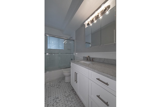 Quart Vanity Top/ Marble Basketweave Floor Tile - Fairfield Courtyard at Lake Grove Apartments