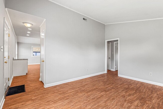Building Photo - NE – Desirable Neighborhood, Brick Home, Wood/Laminate Flooring, Vaulted Ceilings, Carport, Fenced!