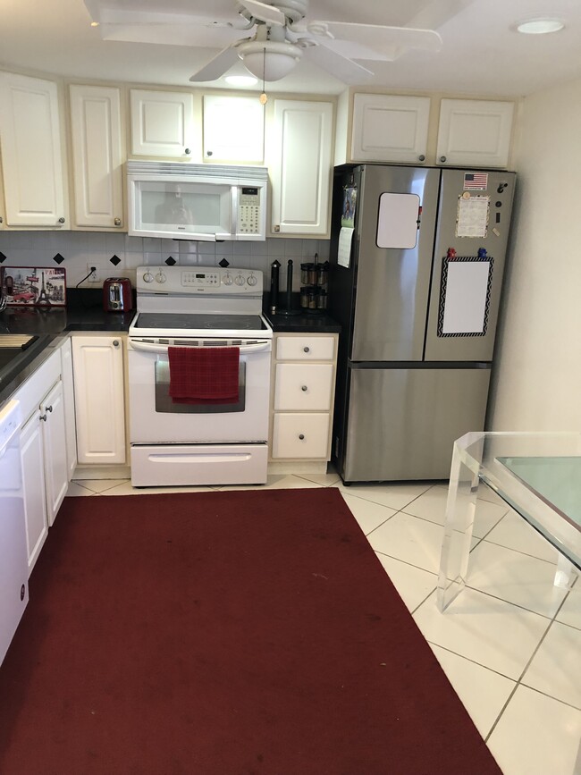 Kitchen - large window view to main room - 2400 NE 1st Ln