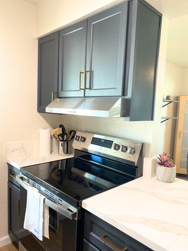 Kitchen with new cabinets, countertops, appliances. **Additional photos are on the way! We're cur - 1795 W 28th St