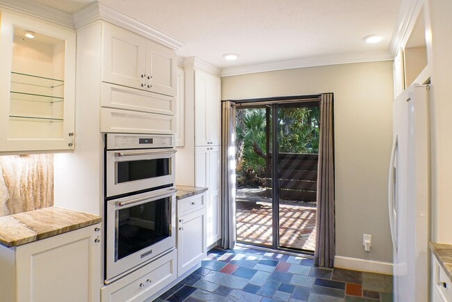 Building Photo - RARE ON MARKET , 2+den 2 1/2 bath overviewing a lake behind bell tower