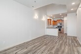 This two-story home in Nampa, Idaho offers a well-organized layout spread across two floors, featuring three bedrooms, three bathrooms, and an attached garage. The main floor greets you with a welcoming entrance that opens into a combined living and dining area, highlighted by light hardwood-style flooring, a ceiling fan with light fixture, and warm wall sconces that create an inviting ambiance. The kitchen is outfitted with warm-toned wood cabinetry, granite countertops, a subway tile backsplash, a stainless steel double sink, and a dishwasher — offering both style and functionality. A pantry and dedicated laundry area add everyday convenience. Upstairs, the three bedrooms feature plush carpeting and natural light from windows fitted with blinds. The primary bedroom includes direct access to a private bathroom. The bathrooms are cleanly finished, with one featuring a dual-sink vanity with granite countertops, wood cabinetry, and a subway tile backsplash. Six closets throughout the home provide ample storage. The attached garage offers generous space with an automatic opener. With its neutral palette and consistent finishes, this home presents a clean, move-in-ready environment throughout.