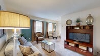 Located at 366 Klagg Ct in Glen Burnie, Maryland, this well-appointed single-floor residence offers a thoughtfully organized layout across five distinct rooms. The living room features soft carpeting, neutral walls, and a window with natural light that creates a warm and inviting atmosphere. Adjacent to the living room, the dining area showcases a striking teal accent wall, a window with outdoor views, and closet storage nearby. The galley-style kitchen is efficiently designed with warm wood cabinetry, granite-toned countertops, tile flooring, and full white appliances including a range and refrigerator. The generously sized primary bedroom is a standout feature, highlighted by a soothing teal accent wall, dual reach-in closets offering ample storage, soft carpeting, and two windows that allow natural light to fill the space. The full bathroom is finished with classic white subway tile accented by sky-blue tile insets surrounding a tub-shower combination, maintaining a clean and timeless aesthetic. Throughout the residence, a cohesive color palette of soft neutrals and teal tones ties the space together, creating a calm and comfortable living environment.