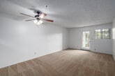 Located at 1210 Calle Jules in Vista, California, this single-floor residence offers two bedrooms and two full bathrooms within a thoughtfully arranged floor plan. The combined living and dining area serves as the heart of the home, featuring neutral carpet flooring, a ceiling fan with light fixture, and a textured ceiling. A glass-paned door opens to one of two balconies, allowing natural light to flow freely into the space. The kitchen is outfitted with warm wood cabinetry extending to the ceiling for ample storage, light countertops, a stainless steel range, and wood-look vinyl flooring. A pass-through opening connects the kitchen to the living area, enhancing the open feel. Both bedrooms are carpeted and include sliding-door closets, with the primary bedroom offering generous proportions and its own closet. The two bathrooms feature tub-shower combinations with sliding glass enclosures, wood-look vinyl flooring, and vanities with warm-toned cabinetry. With six closets distributed throughout, storage is a standout feature of this home. Two hallways connect the main living spaces to the private quarters, and the dual balconies provide outdoor access from multiple points in the residence.