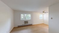 Located at 3779 Swiss Dr in Saint Louis, MO, this single-floor, one-bedroom, one-bathroom unit offers a clean and functional layout across a compact but well-organized footprint. Light wood laminate flooring runs throughout the space, creating a cohesive, bright aesthetic against the crisp white walls and trim.

The living area is open and simply designed, featuring a window that invites natural light and views of surrounding greenery. A baseboard heating unit and wall-mounted air conditioning provide year-round climate control. The bedroom is a comfortable, private space fitted with a ceiling fan with integrated lighting, a sliding-door closet for storage, and a window overlooking the outdoors, continuing the natural light theme present throughout the unit.

The bathroom is neatly appointed with a full tub and shower combo surrounded by clean white surround panels, a vanity with cabinetry for storage, and light wood flooring consistent with the rest of the unit. A ceiling vent ensures proper ventilation.

Overall, this unit presents a clean, move-in-ready interior with a neutral palette, practical storage, and natural light in key living areas — offering a straightforward and functional living environment in the Saint Louis area.