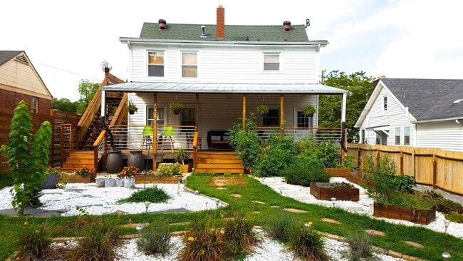 Beautifully landscaped backyard complete with vegetable garden - 1236 Sunnymeade Dr
