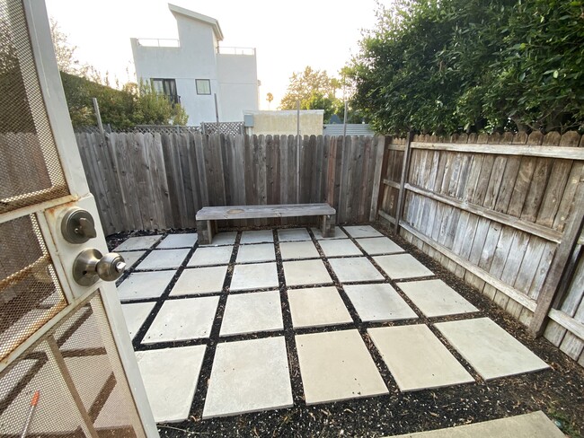 Private yard - looks amazing with some outdoor furniture and plants! - 935 Victoria Ave