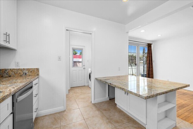 Building Photo - Corner lot home on a classic tree lined Beverly Hills street