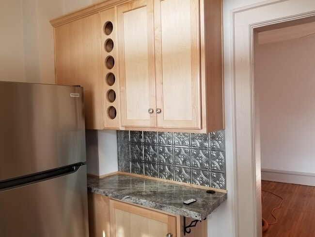 Soft Close Maple Cabinets with built-in wine rack. - 143 W 1st Ave
