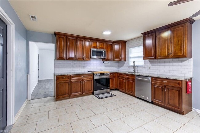 Building Photo - Welcome to this beautifully maintained 4-bedroom! "ASK ABOUT OUR ZERO DEPOSIT"