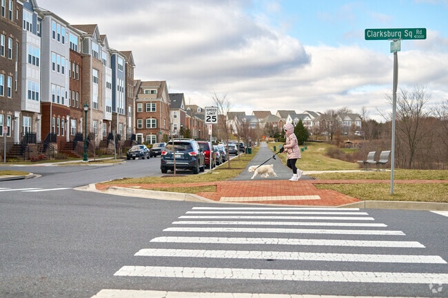 A resident walks through one of Clarksburg's many townhome neighborhoods.