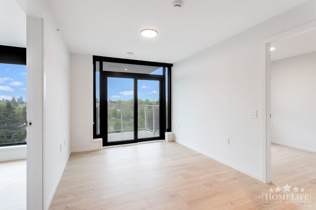 Building Photo - Brand New 2 Bed + Den Condo at FRAME in Norquay Village