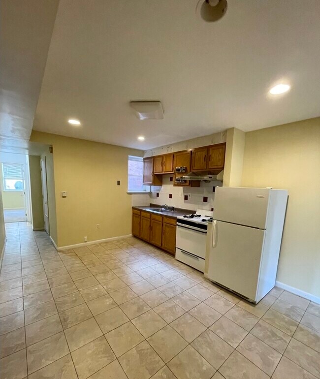 Open kitche area view facing hallway to back room. - 1168 S 10th St