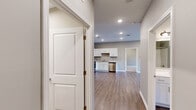 This contemporary apartment offers 870 square feet of thoughtfully designed living space. The open-concept layout seamlessly blends the kitchen and living areas, creating an inviting atmosphere for both relaxation and entertaining. The kitchen boasts sleek white cabinetry, granite countertops, and stainless steel appliances, including a refrigerator, range, microwave, and dishwasher.

The two bedrooms provide ample space, with the primary bedroom measuring 150 square feet. Both bathrooms feature modern fixtures and finishes. The in-unit laundry room comes equipped with a washer and dryer, adding convenience to daily life.

Throughout the apartment, recessed lighting and large windows allow natural light to flood the space. The floors are a combination of warm wood-look vinyl in the main living areas and plush carpeting in the bedrooms, creating a cozy yet stylish ambiance.

Additional features include a ceiling fan in one of the bedrooms and ample closet space. The neutral color palette provides a versatile backdrop for various decor styles. Located at 1601 E Main St in New Albany, IN, this apartment offers a perfect blend of comfort and modern living.