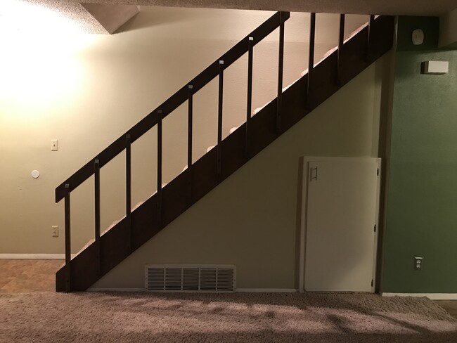view of stairwell from living area (door underneath is for storage) - 1360 N 18th St