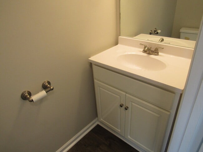 Building Photo - Townhome unit with renovations, trash/lawn...