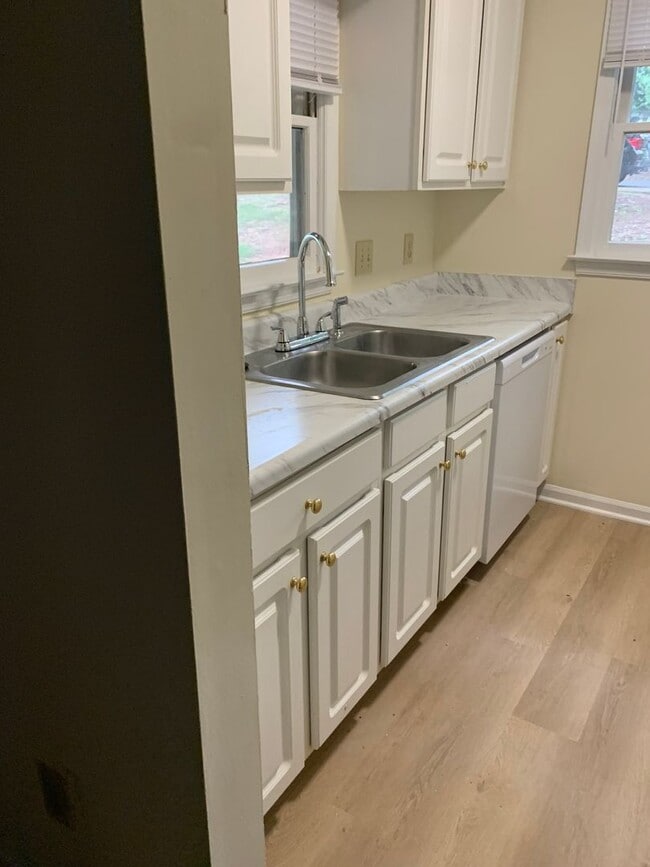 Building Photo - ONE LEVEL CONDO NEAR REX HOSPITAL -Firepla...