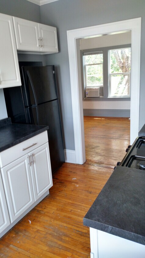 Fridge opposite stove - 1818 W Minnehaha Ave