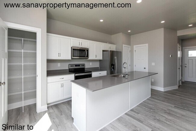 Building Photo - Stunning 4-Bedroom Home with Finished Base...