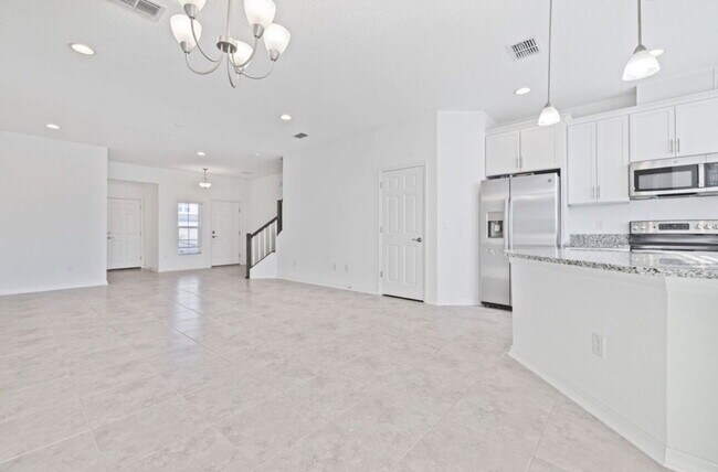 Building Photo - "Charming 3-Bedroom Retreat with Lake View & Pool on Southwell Lane, Wesley Chapel!"